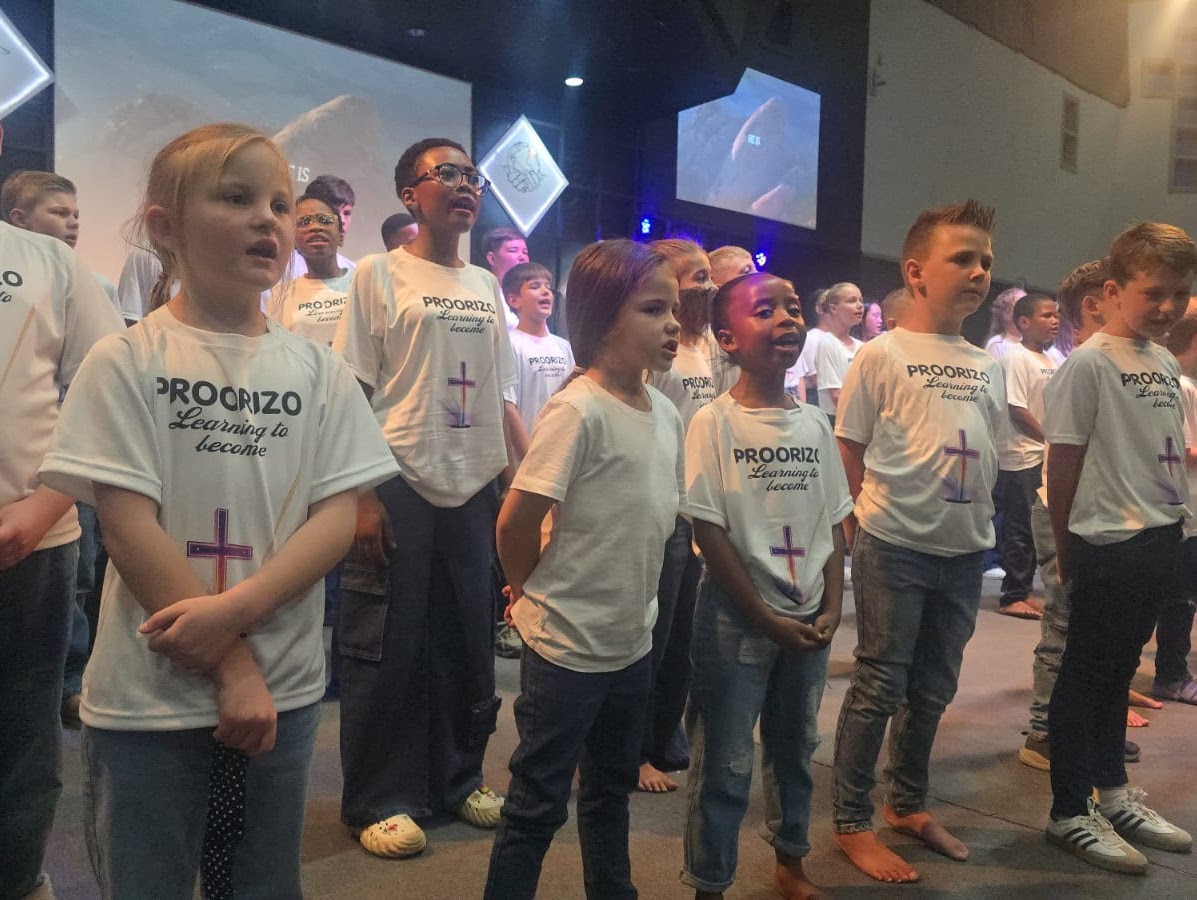 Learners worshipping together in Proorizo shirts.
